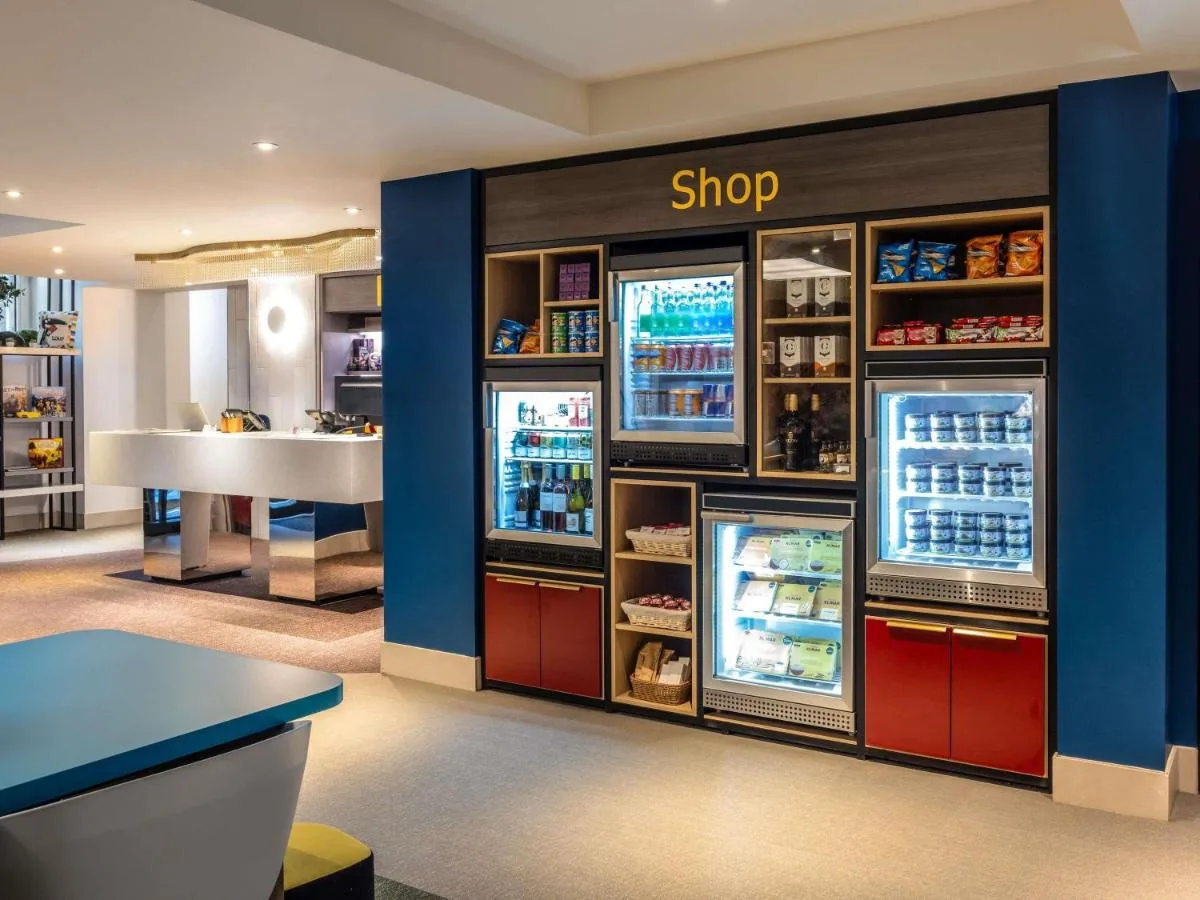 a shop with two refrigerators in a store at Aparthotel Adagio Edinburgh Royal Mile in Edinburgh