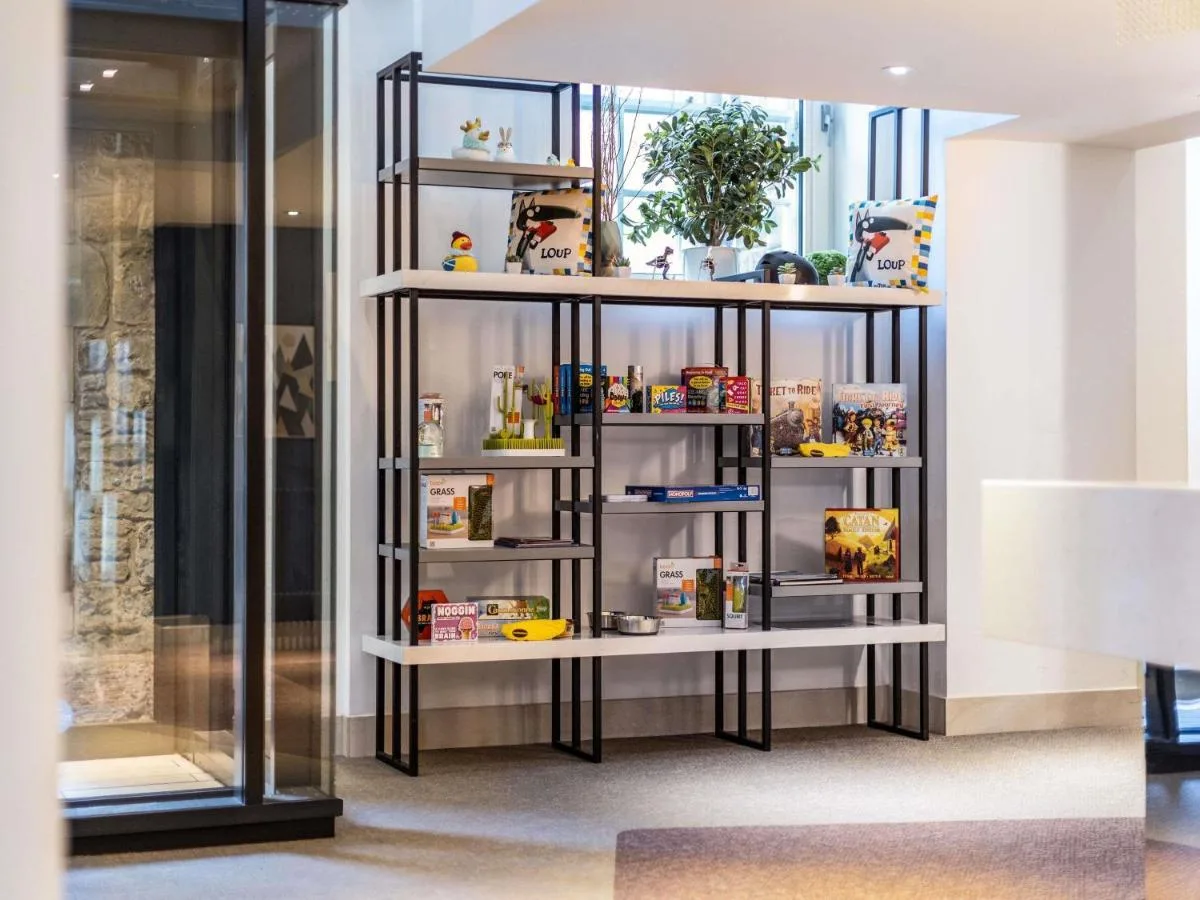 a shelf display rack display rack display shelf display rack display shelf display shelf display rack at Aparthotel Adagio Edinburgh Royal Mile in Edinburgh